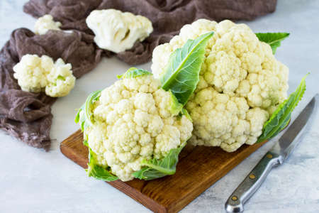 Young fresh organic cauliflower on gray stone or slate background. The concept of a healthy diet.の写真素材