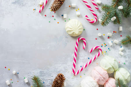Christmas frame. Christmas background with sweets and festive decorations on a vintage stone background.の写真素材