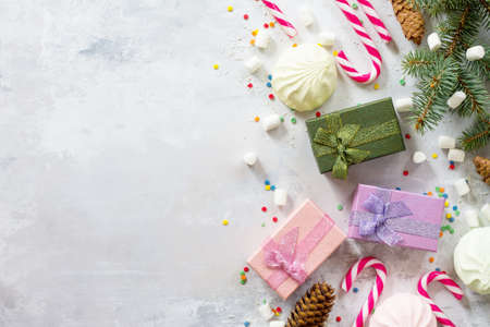 Christmas background with a present and festive decorations on a stone background. Top view with a copy.の写真素材