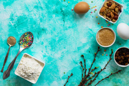 Ingredients for Easter baking - sprinkling confectionery, nuts, eggs, flour, yeast, butter, raisins...