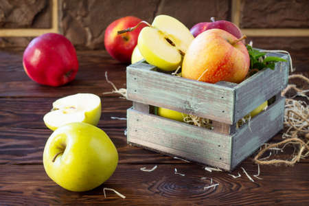Fresh and juicy apples on a wooden table. Still life, diet and nutrition concept.の写真素材