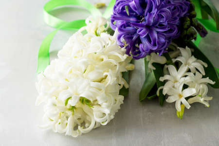 Bouquet of hyacinth flower on stone background or slate. Spring flowers background.の写真素材