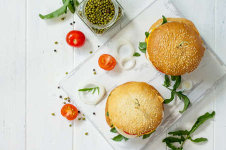 Arabic cuisine. Ramadan food. Homemade vegetarian mung cutlets burger on white a wooden kitchen...