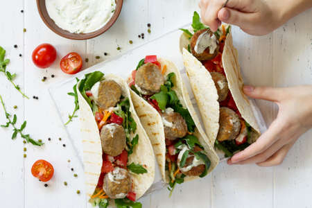 Arabic cuisine. Concept of vegetarian food. Delicious fresh homemade vegetarian tortilla with...