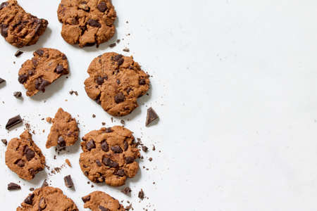 Baked Christmas cookies. Homemade Chocolate Chip Cookies on a light stone table. Top view flat lay...