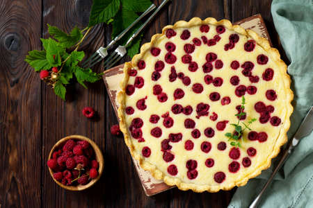 Berry pie summer. Sweet pie, tart with fresh berry raspberries. Delicious cake with raspberries. Top view flat lay.の写真素材
