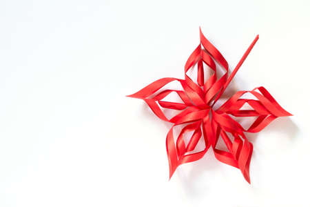 Autumn decor. Maple leaf papercraft isolated on white background. Top view flat lay.の写真素材