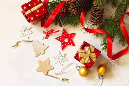 Christmas  concept background.  Branches of spruce, present and red decorations. Top view flat lay...