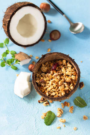 Coconut granola and coconut on a blue stone countertop.の写真素材