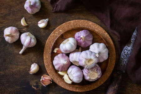 Garlic. Garlic Cloves and Bulb on rustic wooden table. Top view flat lay background.