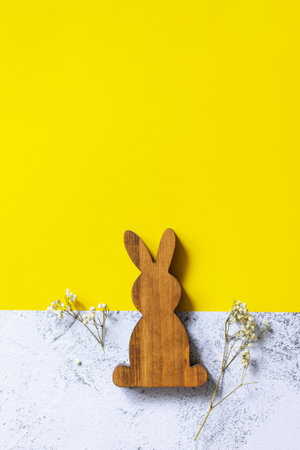 Easter bunny on slate background. Happy Easter mockup. Illuminating Yellow and Ultimate Gray Color of the year 2021. Top view flat lay background.の写真素材