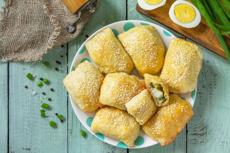 Ukrainian or Russian cuisine. Baked small pies with egg and green onions, spring vitamin baked...