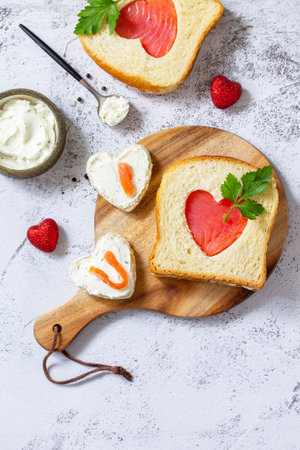 Breakfast for valentine's day or mother's day, toast with salmon and curd cheese with the inscription that I love you.Top view flat lay. Copy space.の素材 [FY310161739177]