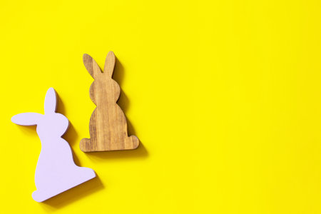 Creative minimal Happy Easter design the rabbits on Illuminating Yellow Color of the year 2021. Top view flat lay background. Copy space.の写真素材