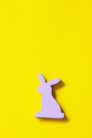 Happy Easter design. Minimal the Easter rabbits on Illuminating Yellow Color of the year 2021. Top view flat lay background.の写真素材