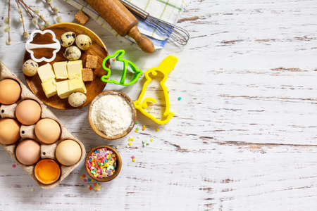 Baking or cooking background frame. Ingredients, kitchen items for Easter festive baking. Kitchen...