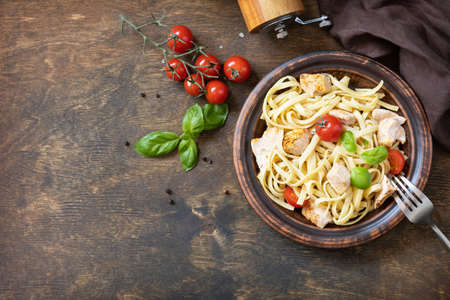 Mediterranean cuisine, seafood diet. Italian spaghetti pasta savory salmon with bechamel sauce on a rustic tabletop. Top view flat lay. copyspace.の写真素材
