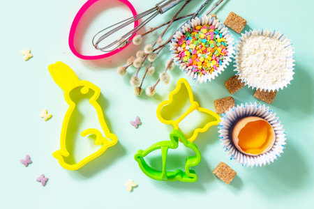 Baking or cooking background. Ingredients for Easter holiday baking. Kitchen utensils, flour, brown...