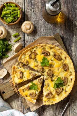 Delicious homemade mushroom quiche with mushrooms and green beans on rustic table. Top view flat lay background.の写真素材
