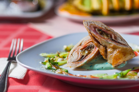 Appetizing meat rolls. with sauce and greensの写真素材