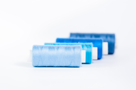 Spools of thread on a white background