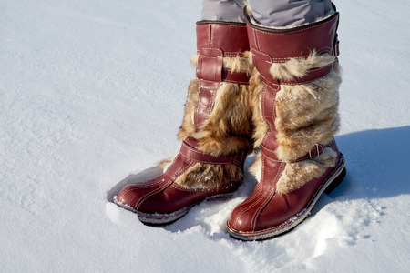 Mongolian fur boots in the snow winterの写真素材