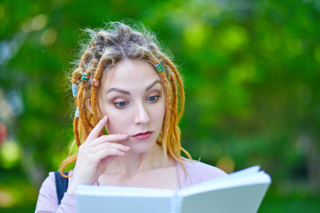 woman Student with notebook. Do not have time to learn. Emotion, amaze, face palm. education, campus and teenage concept.の写真素材