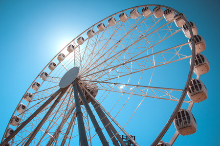 Ferris wheel on sky background.