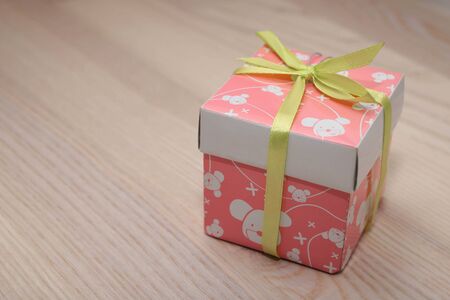 Gift on wooden backgroundの写真素材