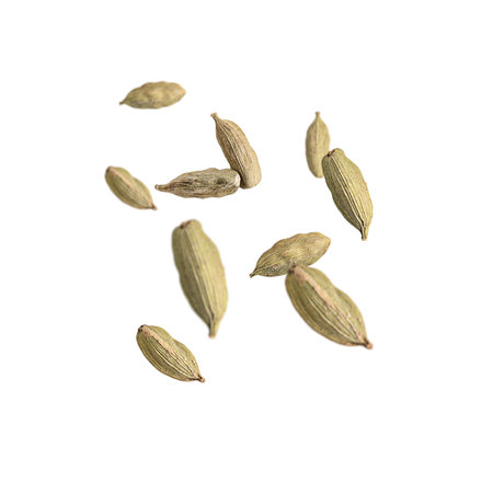 Levitation of flying cardamom spice made from the seeds isolated on white background used as traditional flavorings and cooking condiment in both food and drinkの写真素材
