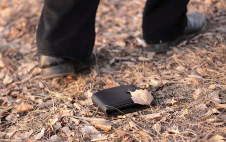 Walking man lost a wallet (outdoorsの写真素材