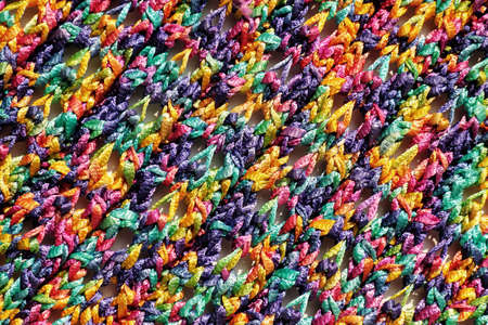 Cloth of bright multi-coloured manual knitting (texture)の写真素材
