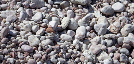 Nature background from gray sea pebbles