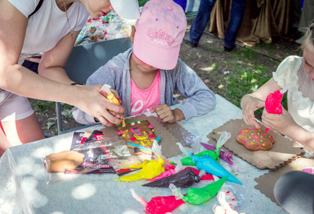 Zaporizhia / Ukraine- May 28, 2017: Charity Family festival: Children, decorating and painting with colorful glaze.のeditorial素材