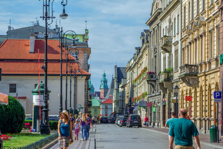 Krakow / Poland - August 15, 2017: Cityscape of old town, tourists and citizens walking on Szpitalna street, view of a town on a sunny dayのeditorial素材
