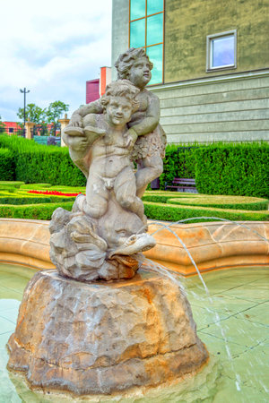 Wroclaw / Poland - August 19, 2017: View of the fountain in a Royal Palace - History museum courtyard, decorated by sculpture of children, holding big fishのeditorial素材