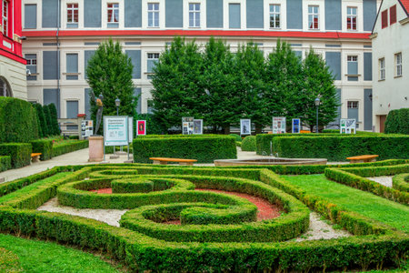 Wroclaw / Poland - August 19, 2017: View of the Ossolineum - the largest scientific library in Poland - courtyard with beautiful garden, fountain and information stands.のeditorial素材
