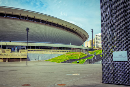 Katowice / Poland- May 2, 2018: view of Spodek - sports and concerts hall in city center, part view of International Congress Hall building with modern design - green grass lawns and symmetric stairsのeditorial素材