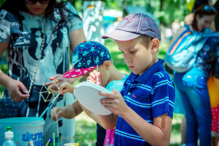 Zaporozhia / Ukraine- June 2, 2018: Participating in a city park. Outdoors art and craft children activity.のeditorial素材