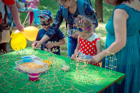 Zaporozhia / Ukraine- June 2, 2018: Carrying out a pair of kids and girls at a workshop outdoors, Creative children activity.のeditorial素材
