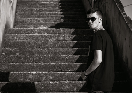 Young man wearing a black dressの写真素材