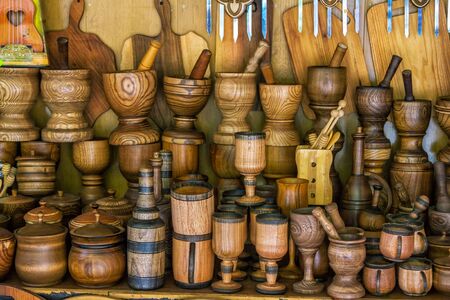 Wooden craft products for sale - mugs, bottles, bowls, cutting boards and mortars. Tableware and kitchen equipment.の写真素材