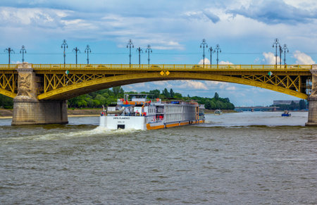 Budapest/Hungary- May 8, 2018: spring cityscape with Danube River, Margaret Bridge, large cruise touristic boat and park on Margit Island.のeditorial素材