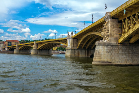 Budapest / Hungary- May 8, 2018: view of Danube River water surface, close up Margaret Bridge, decorated with statues. Spring cityscape with blue sky.のeditorial素材