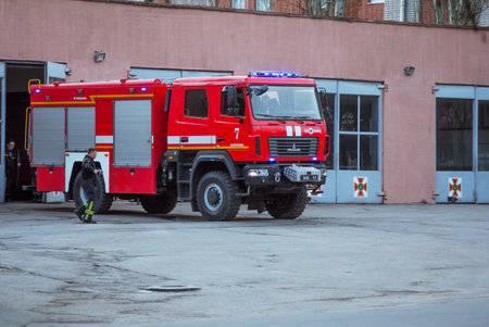 Zaporizhzhia / Ukraine - March 9, 2020: view of municipal red fire engine - rescue and emergency service outside the fire stationのeditorial素材