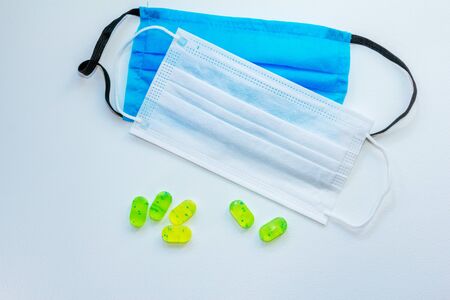 Blue and white medical masks and lozenges for cough and sore throat reliefの写真素材