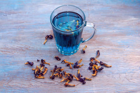 Organic Butterfly pea flowers blue Anchan  tea in a glass cup. Detox healthy drink.の写真素材