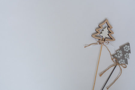 Christmas trees made of wood for decoration isolated on white background. Christmas layout with place for text, wishes. Top view, flat layoutの写真素材