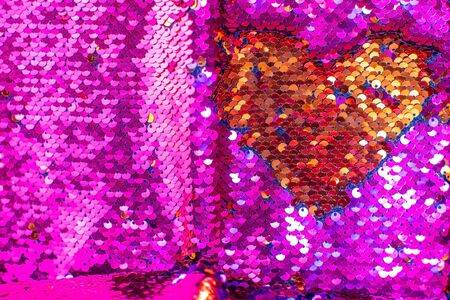 Bright fabric with brilliant paillettes. Rose gold hearts glitter, Abstract holidays background. Texture, light bokeh background, Glitter lights background, super macroの写真素材