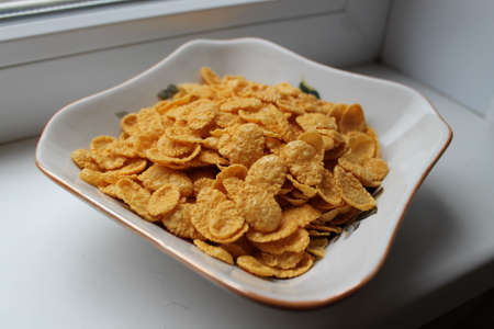 golden crust corn flakes for breakfast in cube plateの写真素材